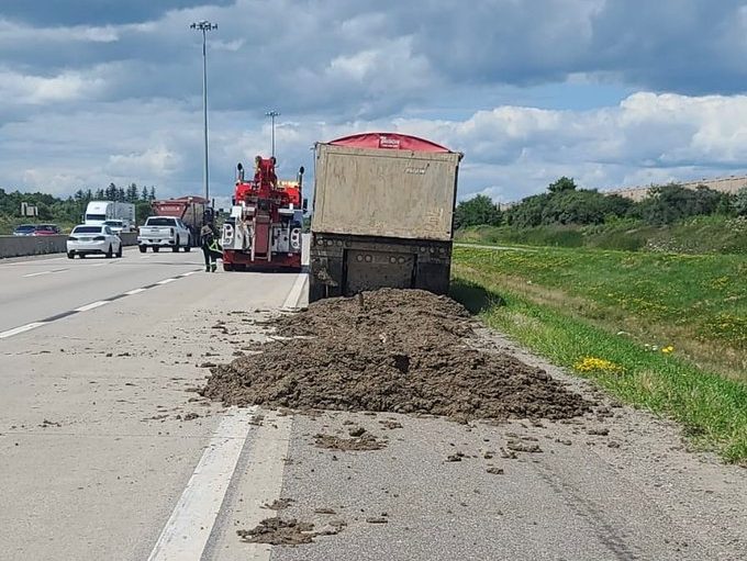 Truck loses dirt load on Hwy 410