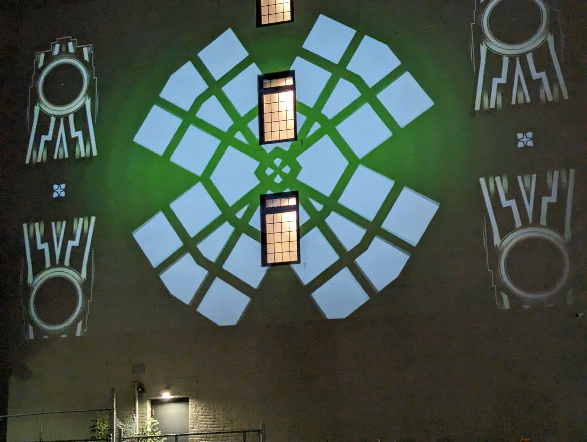 A multi-media art projection on the wall of 70 King from Oshawa-born Jenn E Norton during Convergence 2023