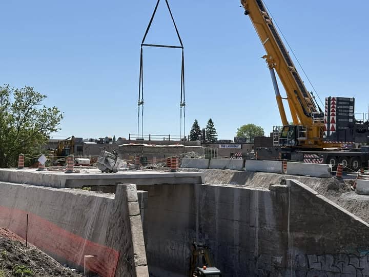 Removing the Simcoe Street bridge over the rail tracks in Oshawa, one beam at a time.