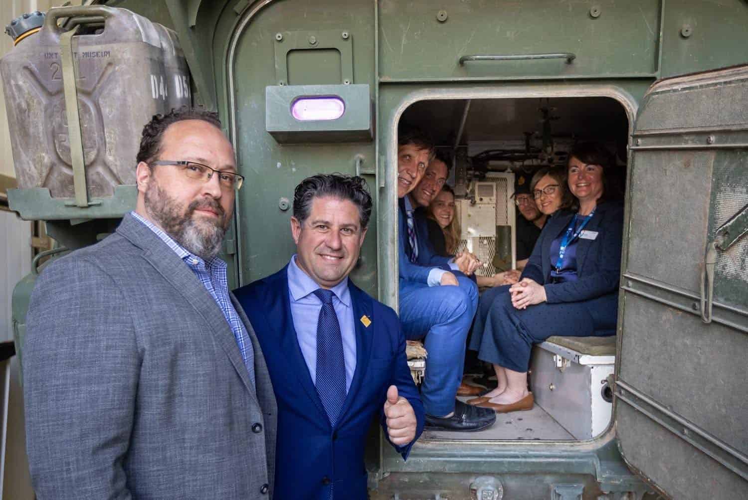 Automotive Parts Association President Flavio Volpe and Oshawa Regional Councillor Tiito-Dante Marimpietri testing military vehicles in Oshawa