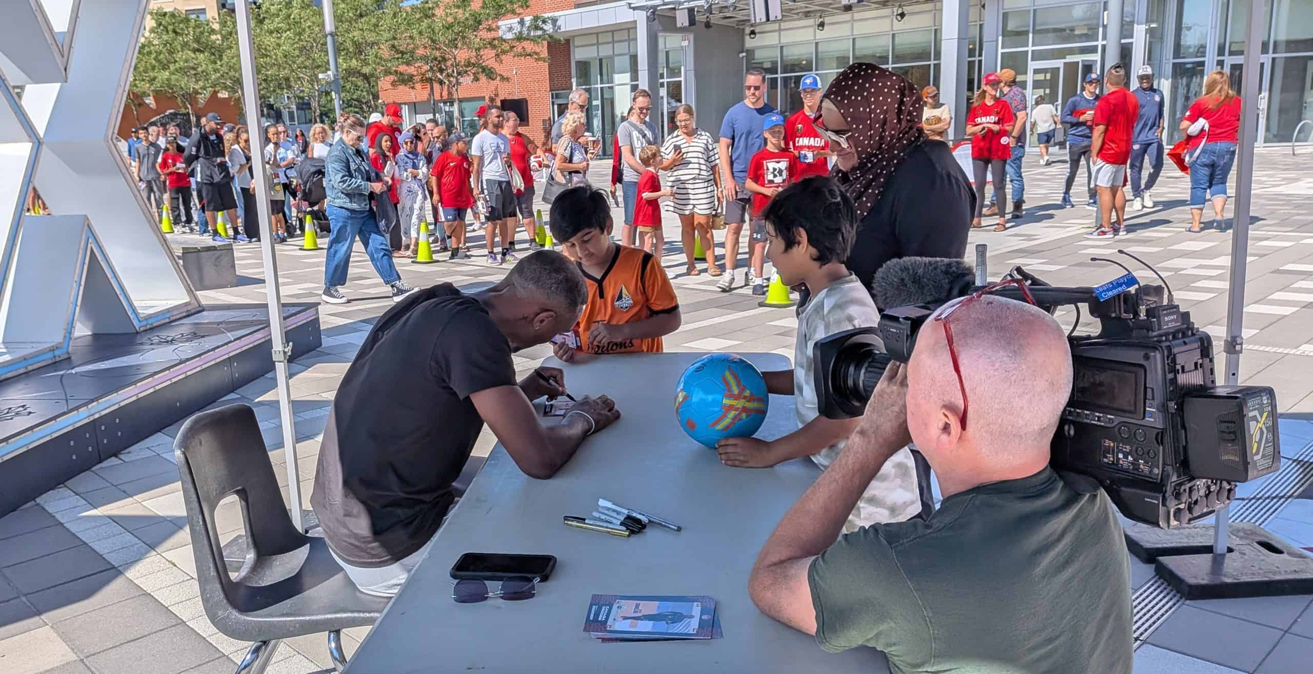 Local soccer star Derek Cornelius signing for fans at meet-and-greet in Ajax